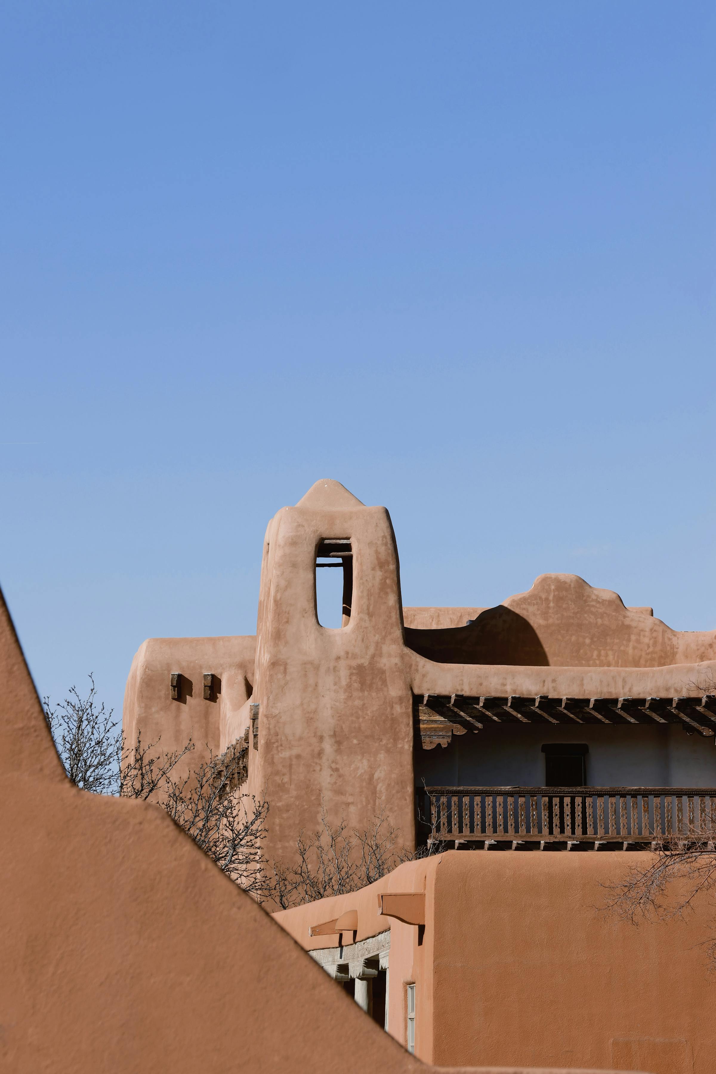 Sunlit adobe-style buildings in the high desert — neighborhood character around Albuquerque