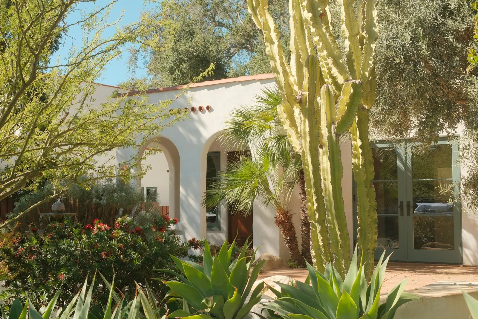 Spanish-style house with desert landscaping and xeriscape front yard, Albuquerque area